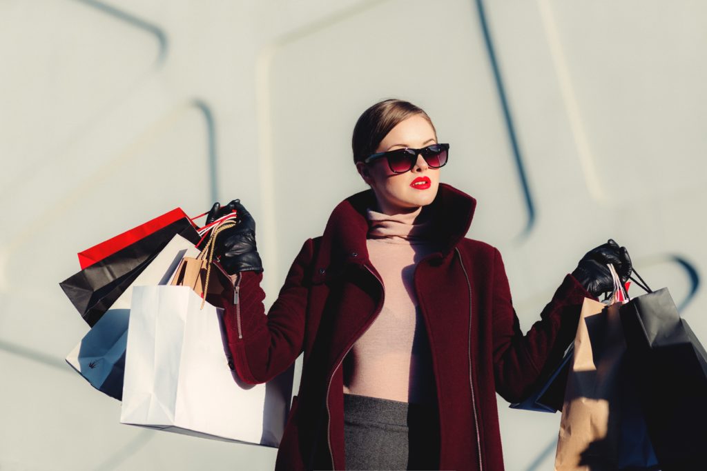 woman with luxury shopping bags